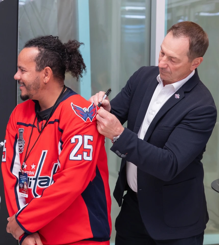 Jonathan Hall has his jersey signed by Caps legend Peter Bondra.