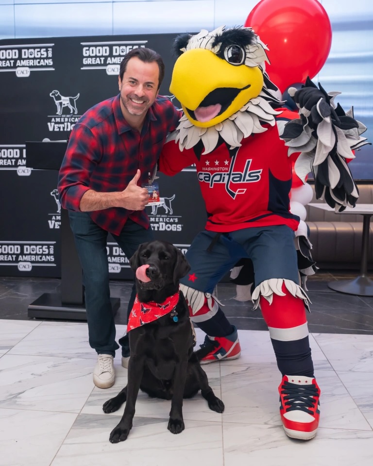 Grant DeMola with Caps mascot Slapshot and Gunner.
