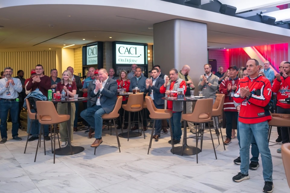 CACI employees show their Washington Capitals pride.